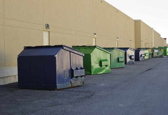 a row of large construction dumpsters on-site in Fanwood